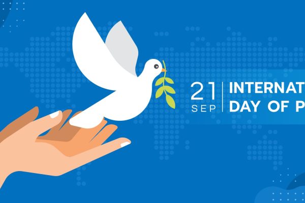 International day of peace - Both hands are letting the dove of peace to fly on blue map world texture background vector Design